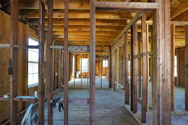 a view of a porch with a glass door and furniture