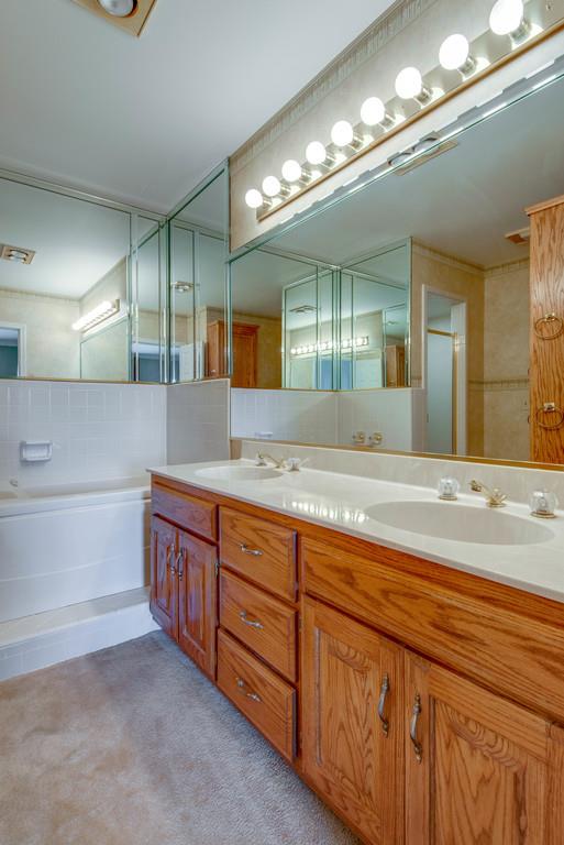 700 General George Patton Road Nashville, TN 37221 - Photo 15 of 21 a spacious bathroom with double vanity and a mirror