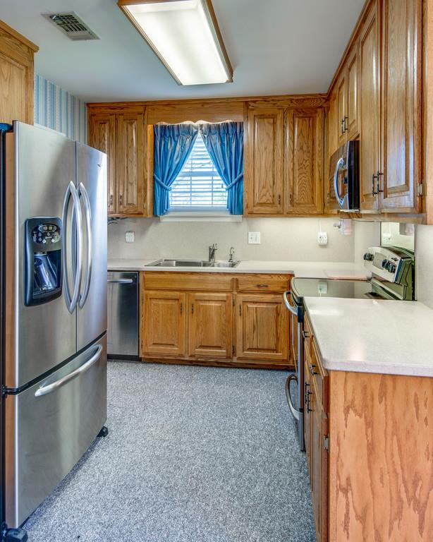 700 General George Patton Road Nashville, TN 37221 - Photo 5 of 21 a kitchen with stainless steel appliances granite countertop a sink stove and refrigerator
