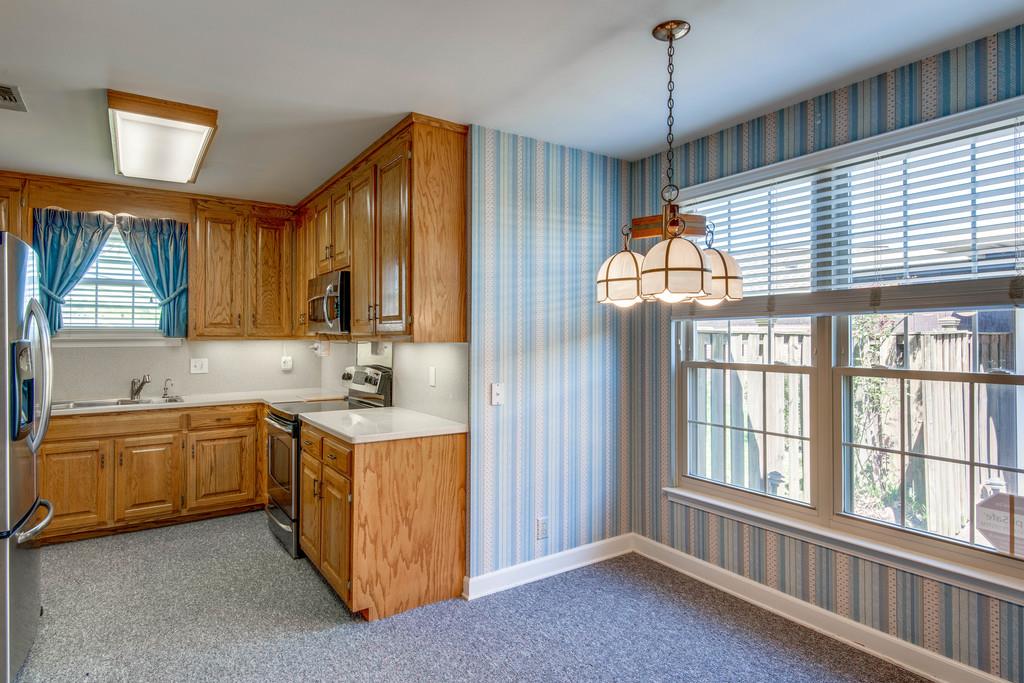 700 General George Patton Road Nashville, TN 37221 - Photo 6 of 21 a kitchen with a stove a sink and a refrigerator