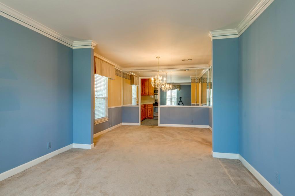 700 General George Patton Road Nashville, TN 37221 - Photo 10 of 21 a view of a big room with wooden floor and a kitchen