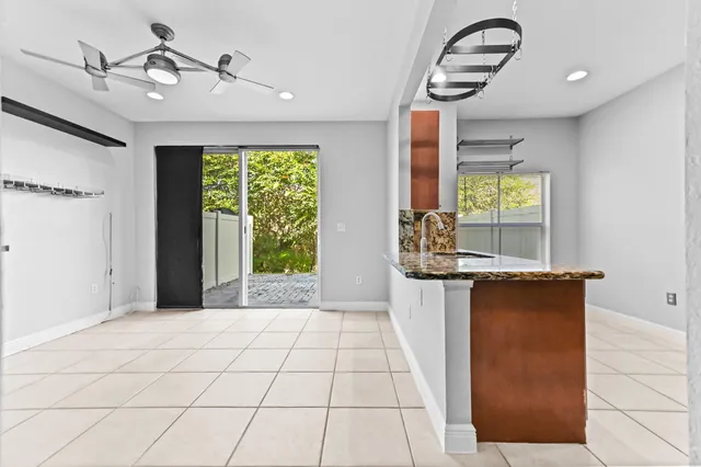 a view of kitchen with windows and chandelier