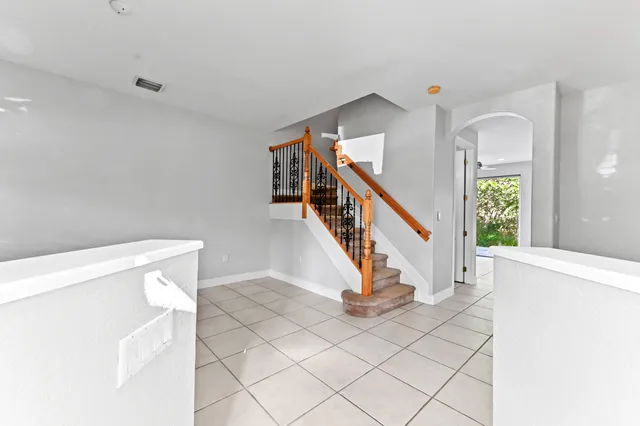 a view of an entryway with wooden floor