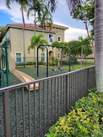 a view of backyard with a table and chairs