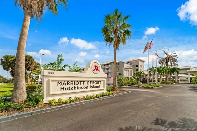 an aerial view of a residential house with outdoor space