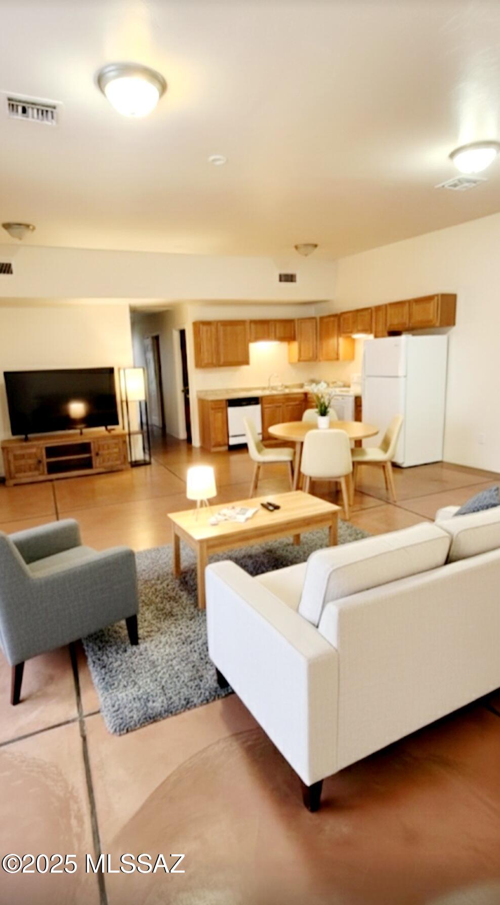 533 West San Xavier Road Tucson, AZ 85713 - Photo 17 of 21 a living room with furniture and a flat screen tv