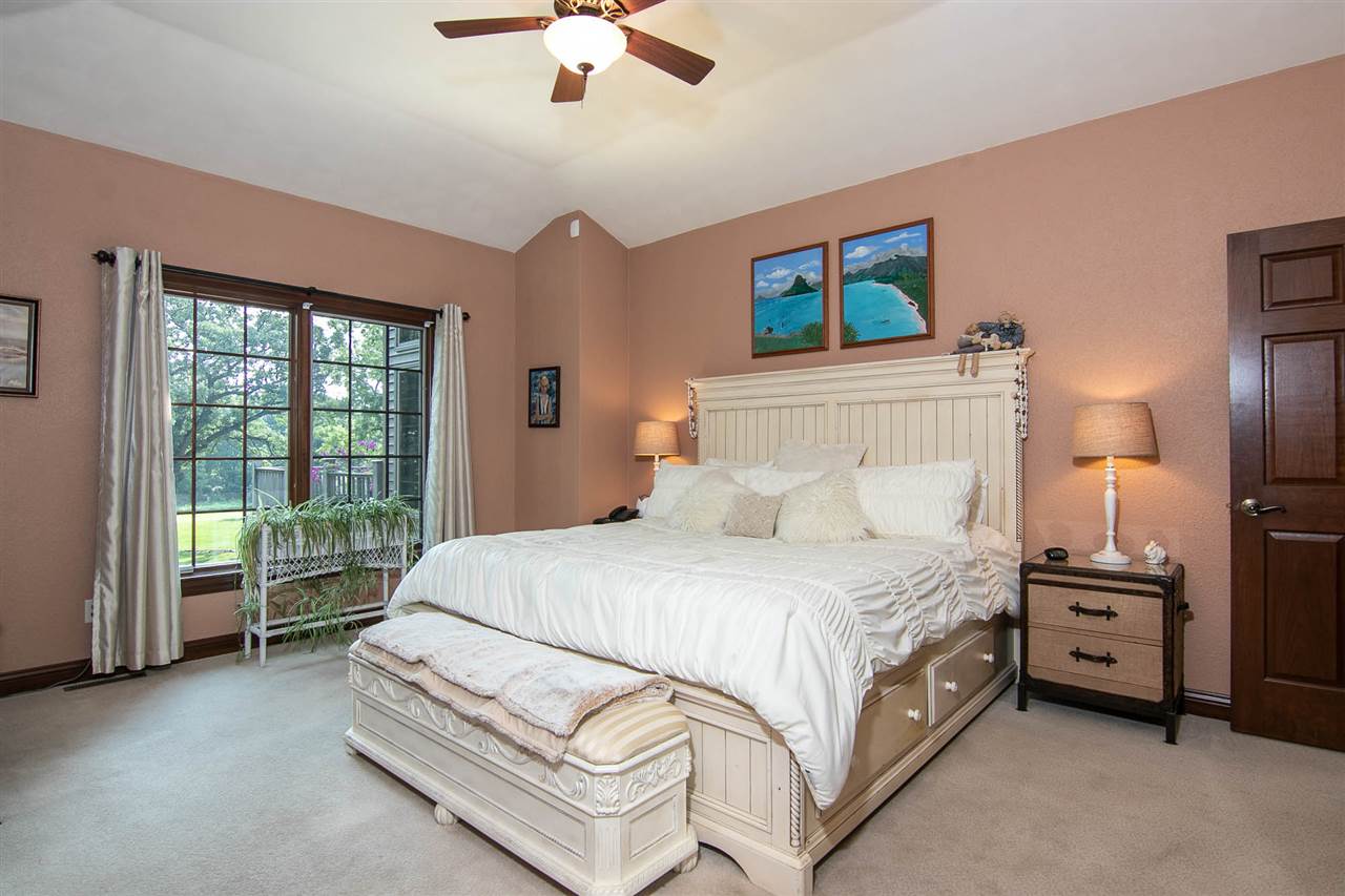 12019 Patterson Road Durand, IL 61024 - Photo 13 of 25 a bedroom with a bed and a chandelier