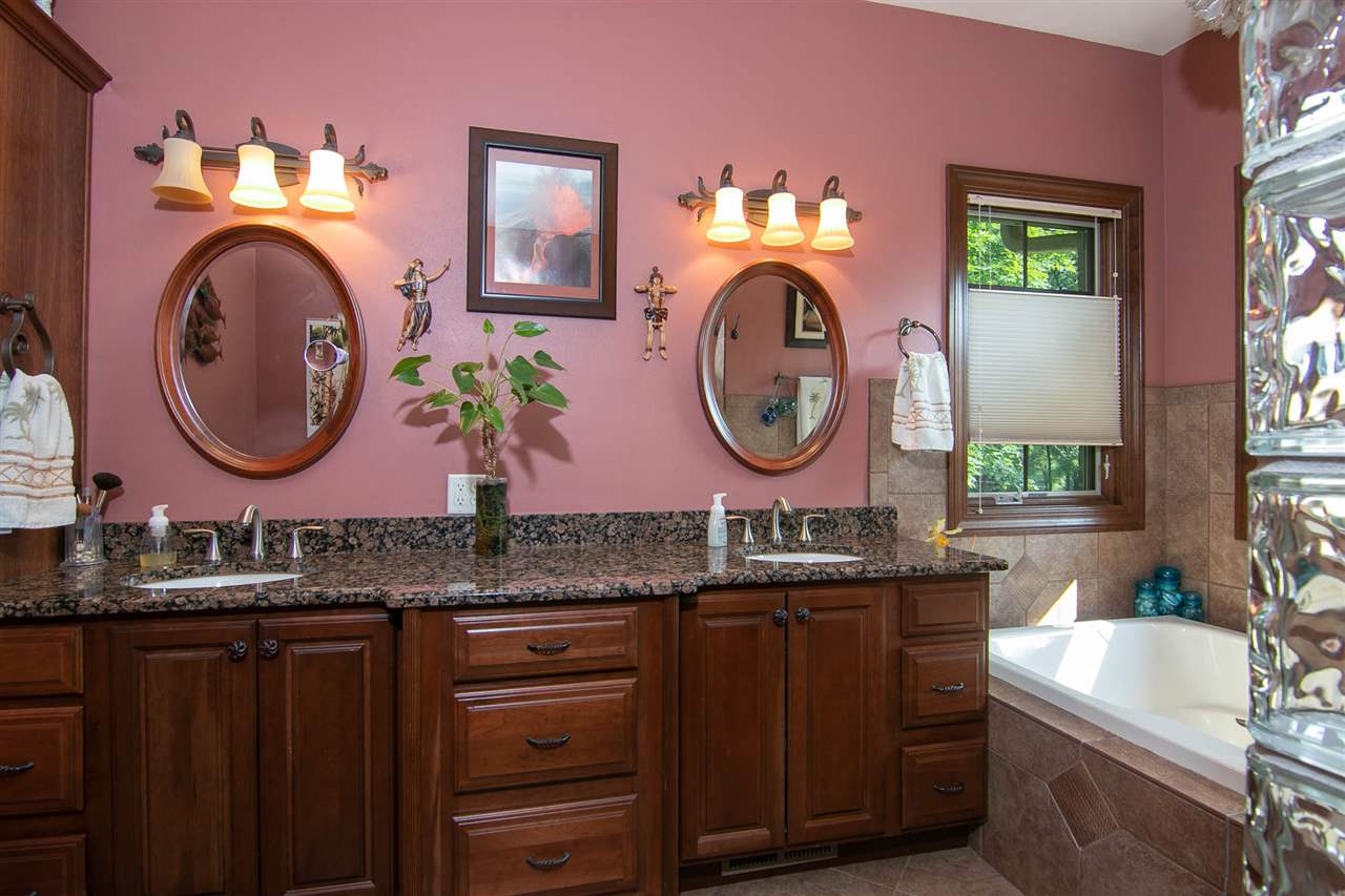 12019 Patterson Road Durand, IL 61024 - Photo 14 of 25 a bathroom with a sink and a mirror