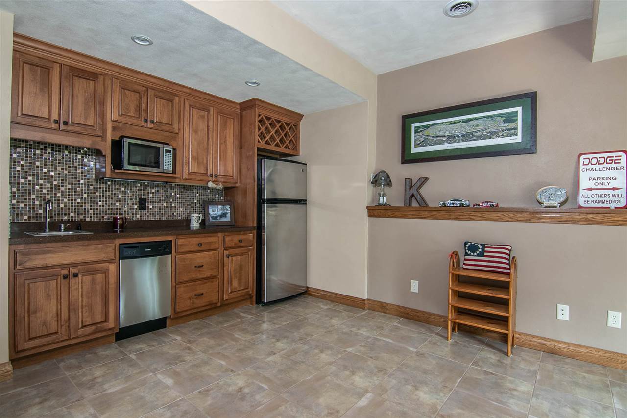 12019 Patterson Road Durand, IL 61024 - Photo 23 of 25 a kitchen with stainless steel appliances a stove and cabinets