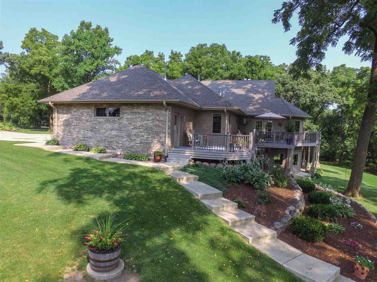 12019 Patterson Road Durand, IL 61024 - Photo 3 of 25 a front view of a house with a garden