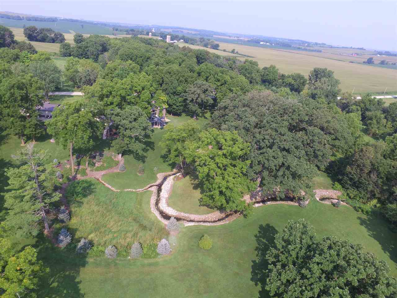 12019 Patterson Road Durand, IL 61024 - Photo 6 of 25 a view of a lake with a mountain in the background