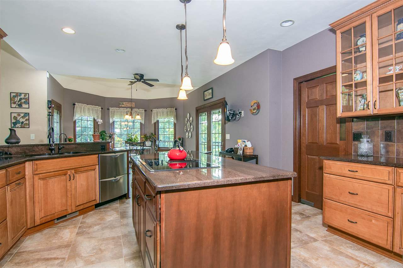 12019 Patterson Road Durand, IL 61024 - Photo 9 of 25 a kitchen with cabinets a sink and appliances