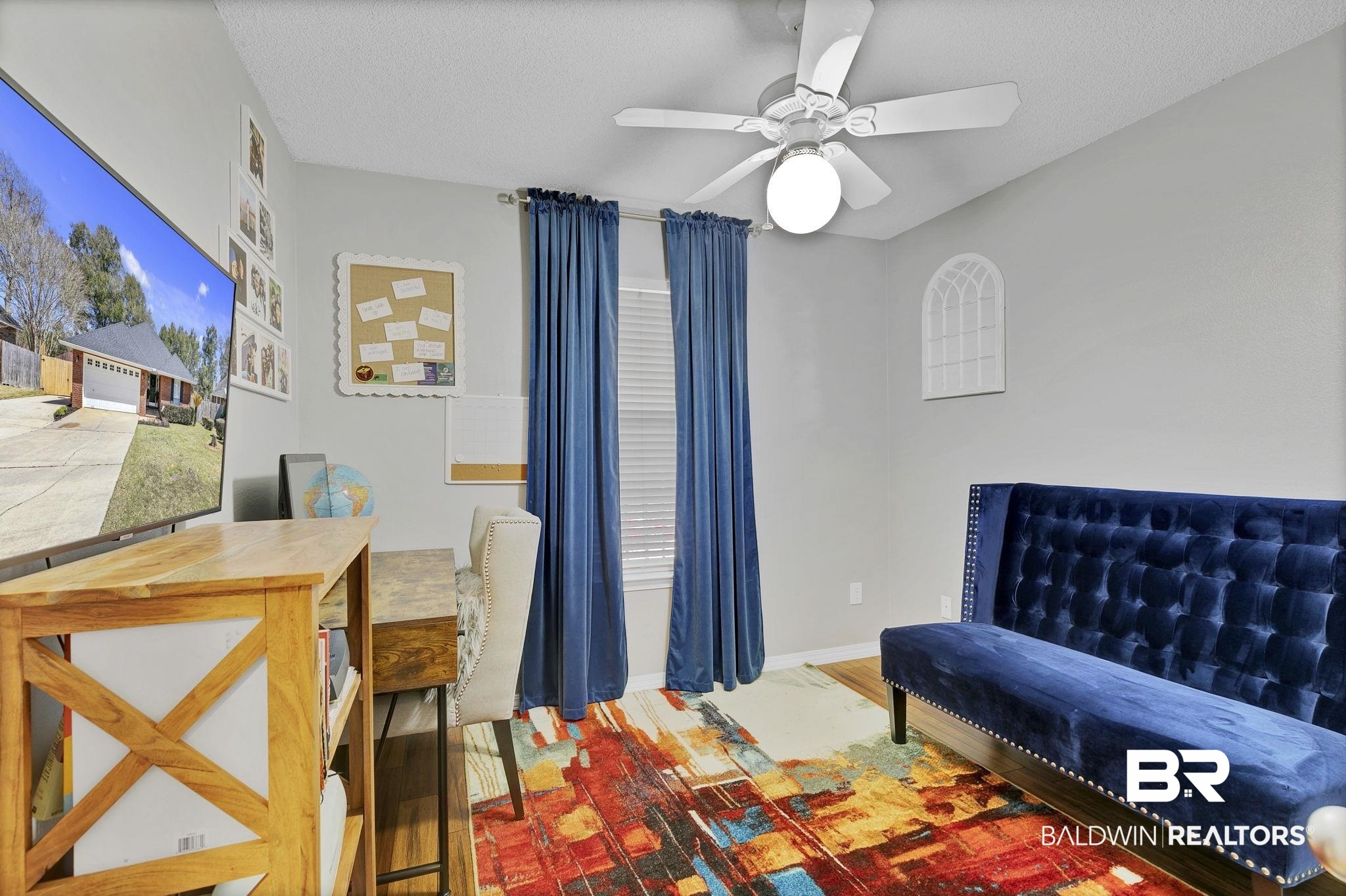 11103 Pontchartrain Loop Daphne, AL 36526 - Photo 21 of 29 Bedroom featuring ceiling fan, wood finished floors, baseboards, and a textured ceiling