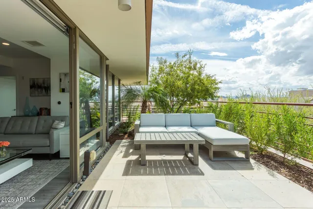 a view of a balcony with furniture