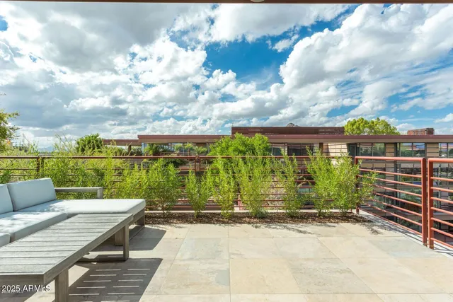 a view of a patio with wooden floor