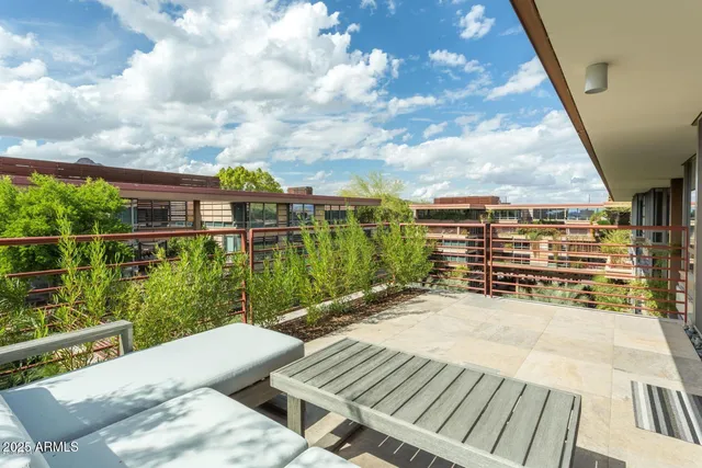 a view of a balcony with mountain view and wooden floor