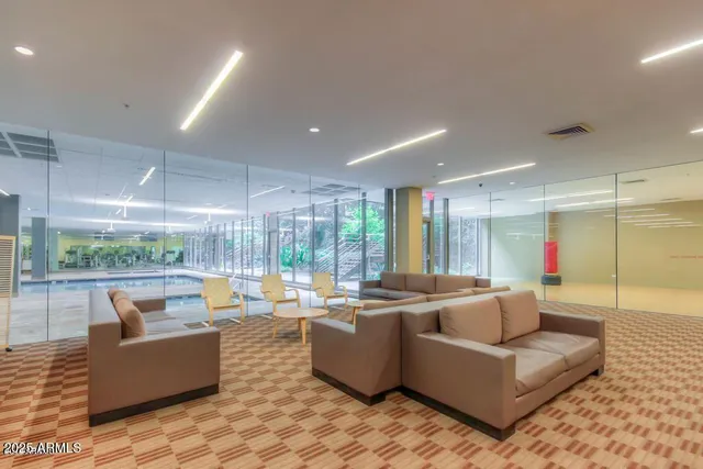 a living room with couch and a large window