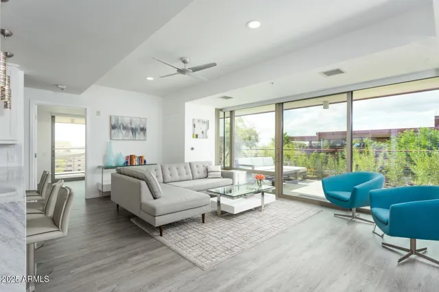 a living room with furniture and a large window