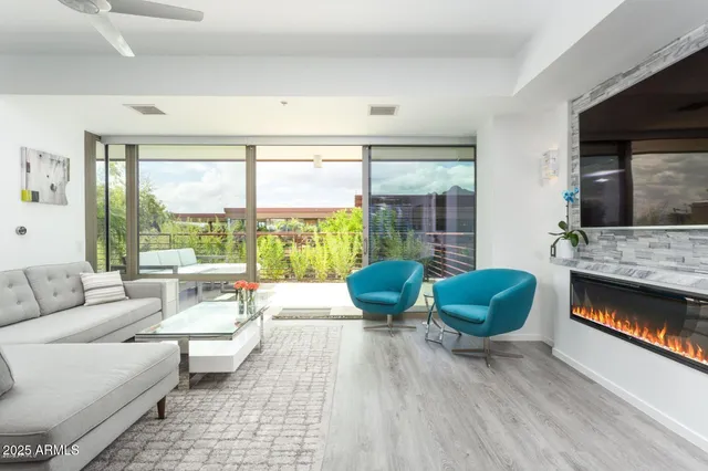 a living room with furniture and a fireplace