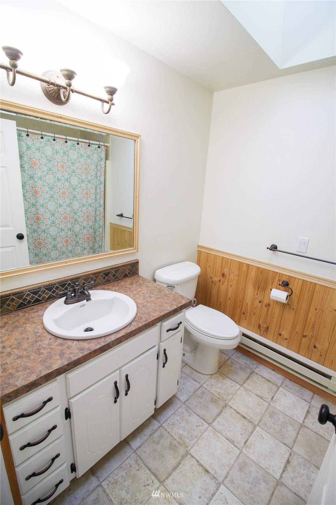 18245 Cinnamon Lane Southwest Rochester, WA 98579 - Photo 14 of 22 a bathroom with a granite countertop sink a toilet and a mirror