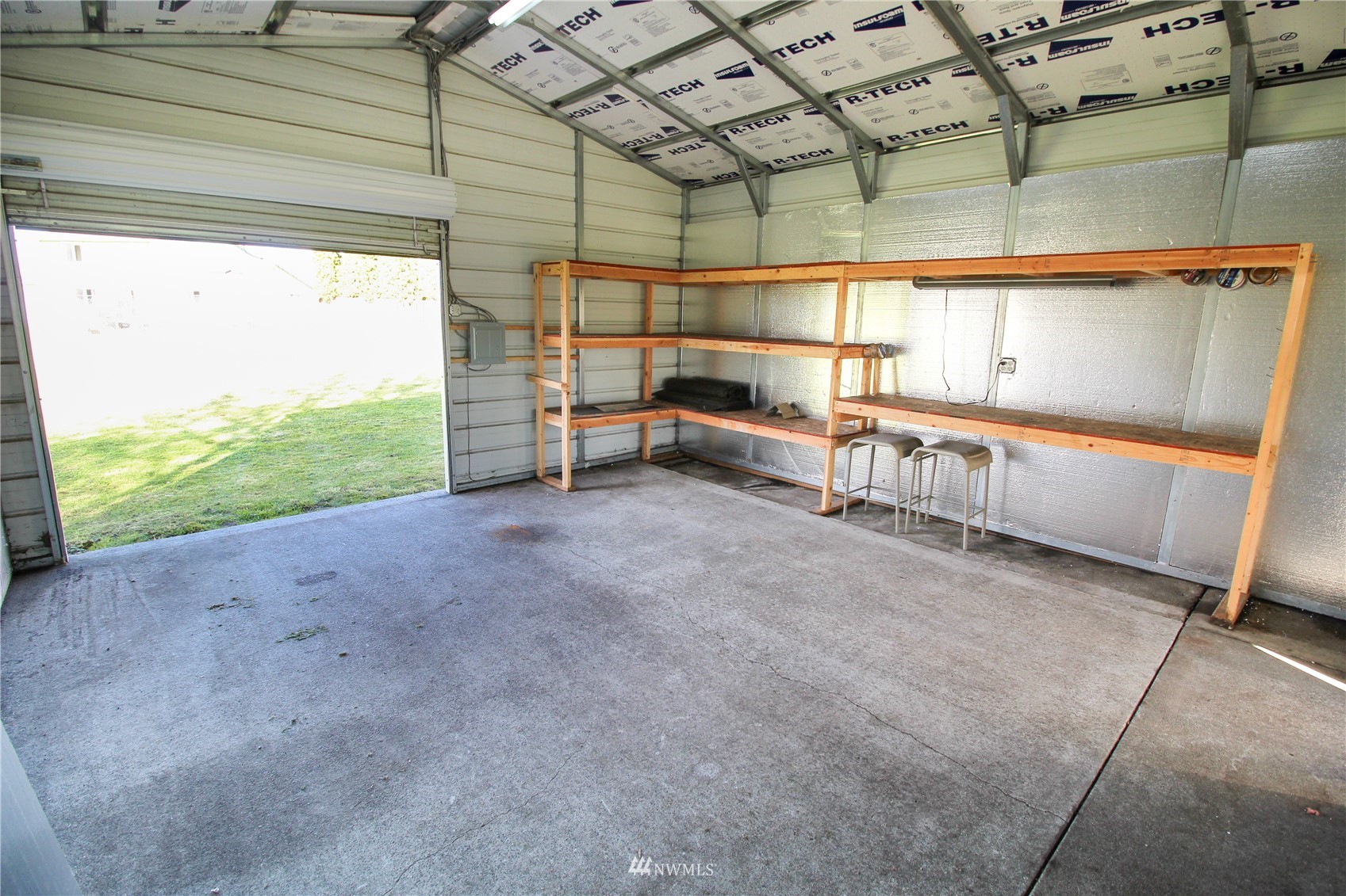 18245 Cinnamon Lane Southwest Rochester, WA 98579 - Photo 20 of 22 a view of a room with racks on the wall