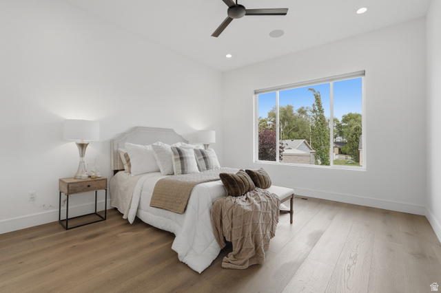 653 East Vandalay Lane Draper, UT 84020 - Photo 23 of 61 Spacious room featuring light wood-finish flooring, a contemporary ceiling fan, recessed lighting, and a large window