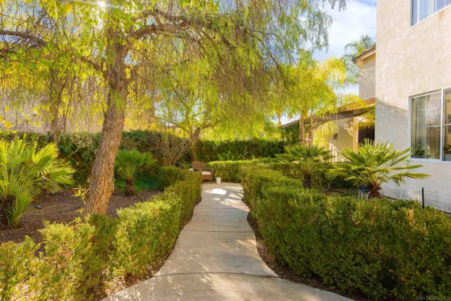 a view of a pathway both side of house