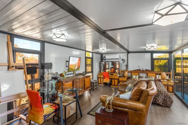 an aerial view of residential houses with outdoor space