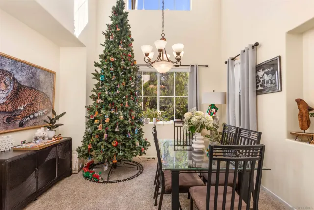 a living room with furniture and flowers