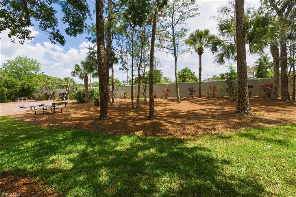 415 Crossfield Circle, Unit 81 Naples, FL 34104 - Photo 20 of 33 a view of a park with tree s