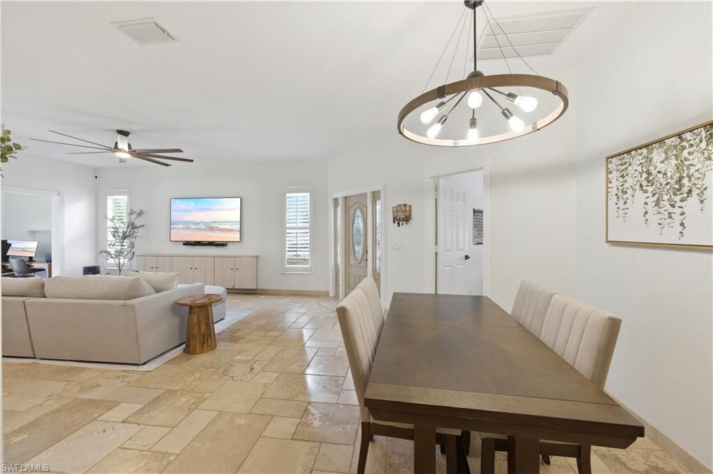 415 Crossfield Circle, Unit 81 Naples, FL 34104 - Photo 4 of 33 a view of a dining room with furniture