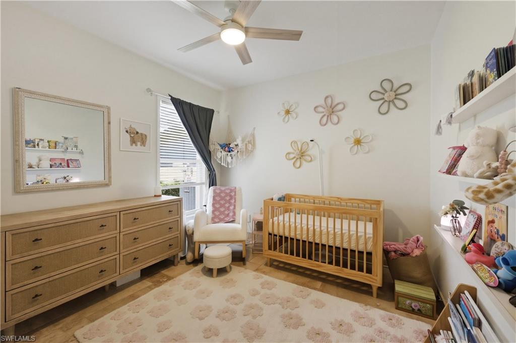 415 Crossfield Circle, Unit 81 Naples, FL 34104 - Photo 6 of 33 a bedroom with a bed and a window