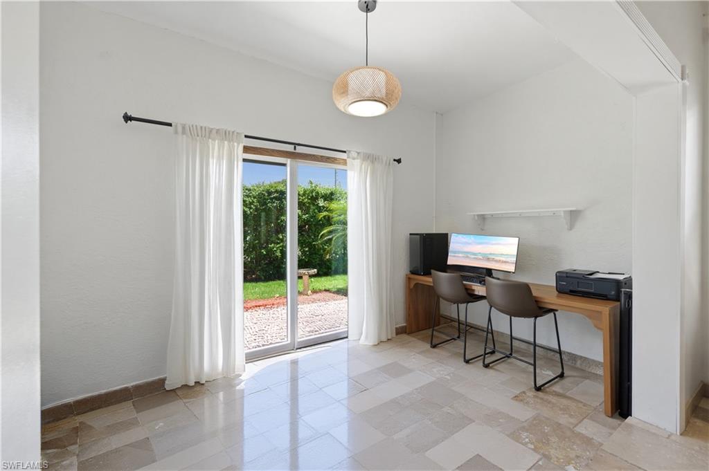 415 Crossfield Circle, Unit 81 Naples, FL 34104 - Photo 8 of 33 a view of a workspace with furniture and a window