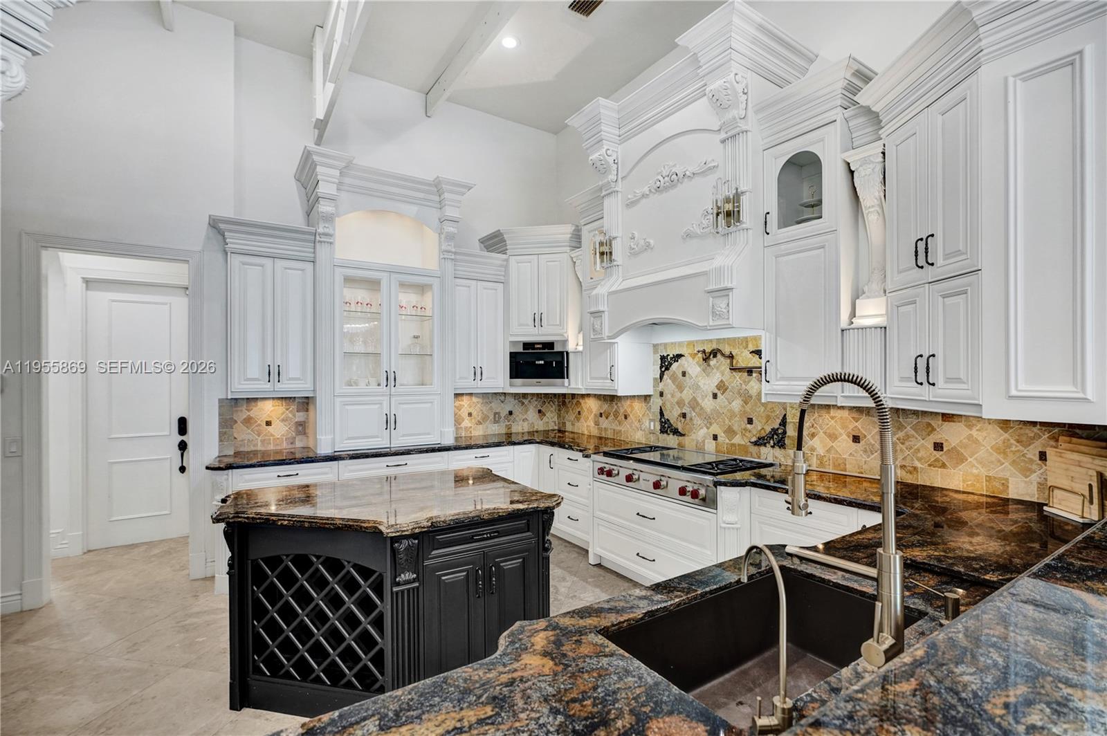 3175 Hunter Road Weston, FL 33331 - Photo 7 of 45 a kitchen with a stove and a refrigerator