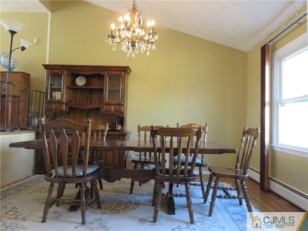 6 Library Place Edison, NJ 08820 - Photo 3 of 17 a view of a dining room with furniture and wooden floor