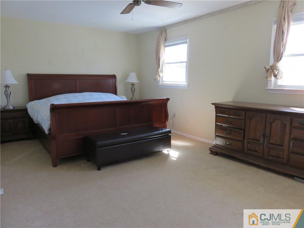 6 Library Place Edison, NJ 08820 - Photo 8 of 17 a bedroom with a bed and a window