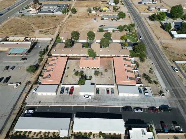 an aerial view of residential houses with outdoor space