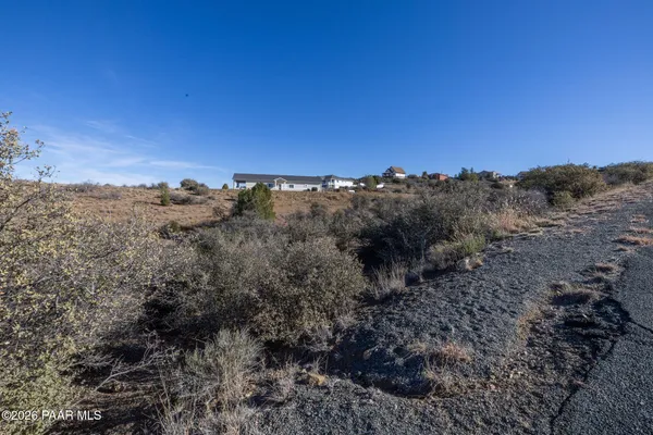 an aerial view of residential house and sandy dunes