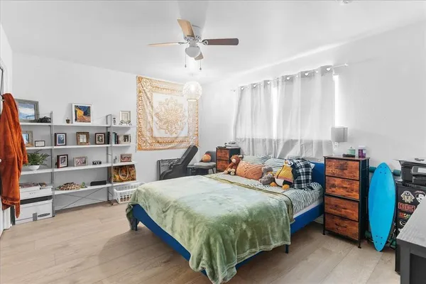a bed room with a bed and a book shelf