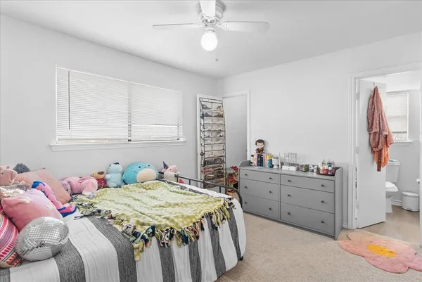 a bedroom with a bed and a cabinets