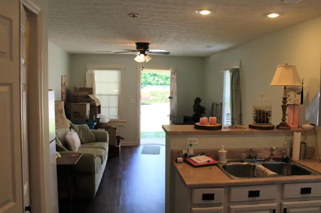 a kitchen with stainless steel appliances granite countertop a stove and a sink