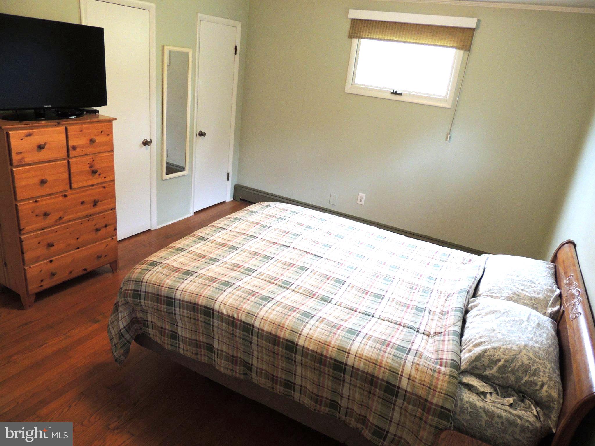 5838 Oklahoma Road Sykesville, MD 21784 - Photo 44 of 72 Cozy bedroom with warm wooden accents.