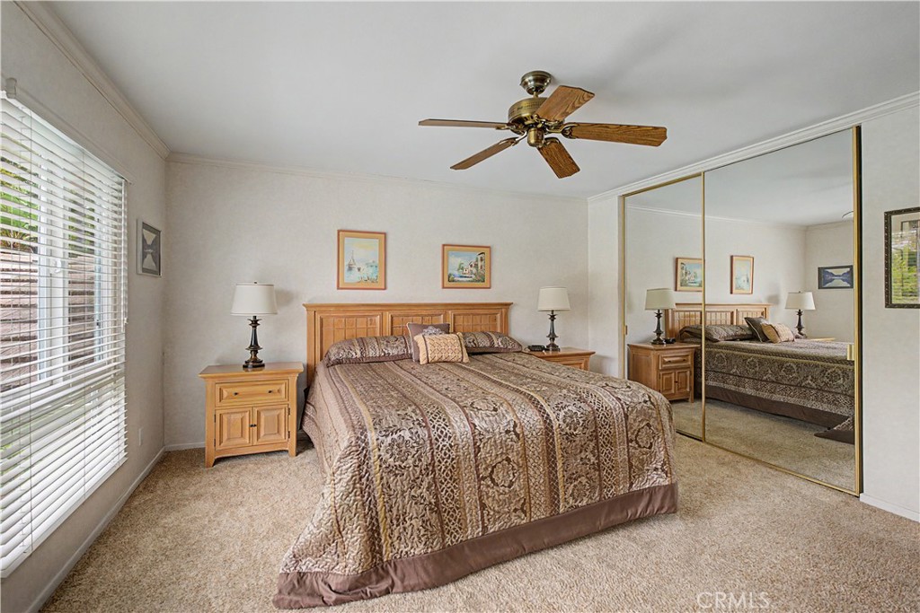 22671 Town Crier Road Calabasas, CA 91302 - Photo 30 of 35 a bedroom with a bed and wooden floor