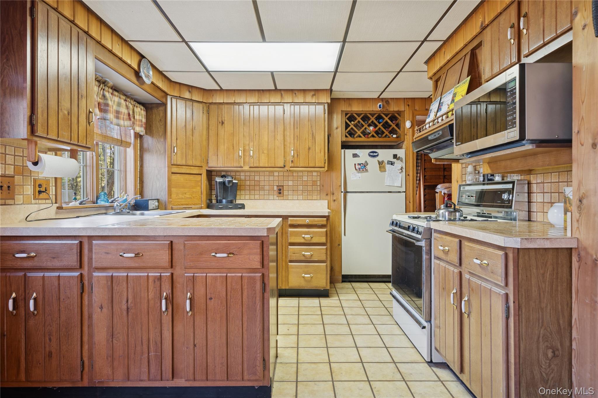 37 Nober Strunk Road Narrowsburg, NY 12764 - Photo 12 of 50 a kitchen with stainless steel appliances a sink stove and cabinets