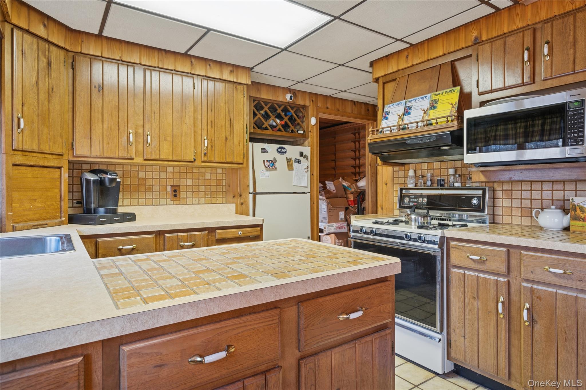 37 Nober Strunk Road Narrowsburg, NY 12764 - Photo 14 of 50 a kitchen with stainless steel appliances granite countertop a stove and a refrigerator