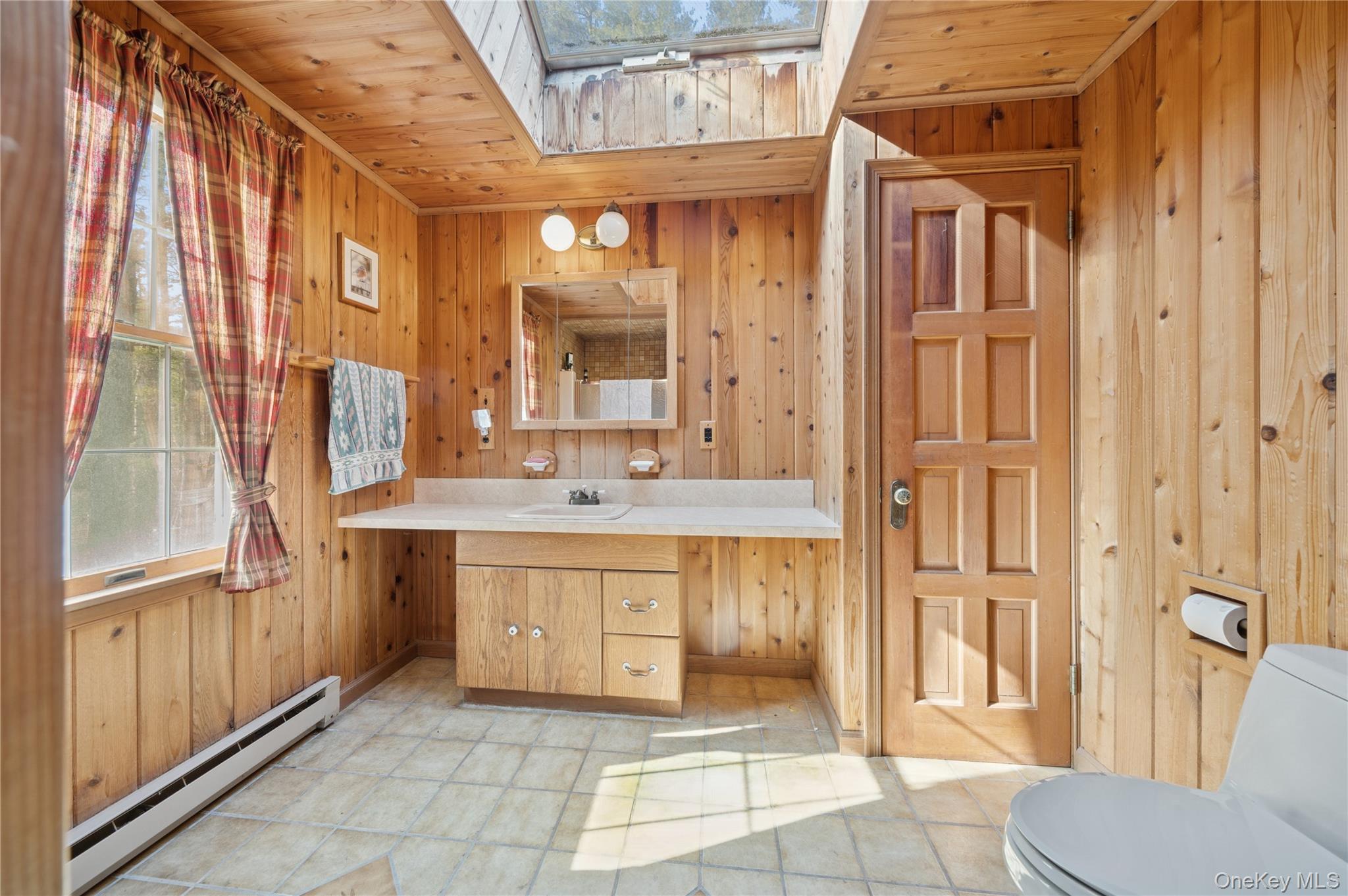 37 Nober Strunk Road Narrowsburg, NY 12764 - Photo 20 of 50 a bathroom with a sink a toilet and shower