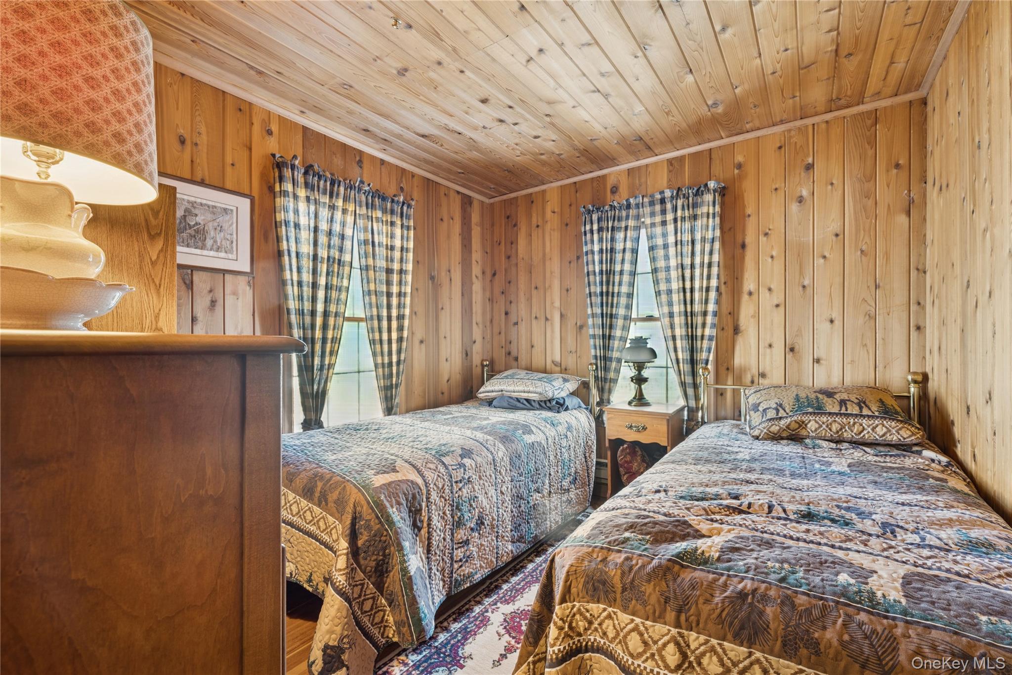 37 Nober Strunk Road Narrowsburg, NY 12764 - Photo 26 of 50 a bedroom with two beds and a window