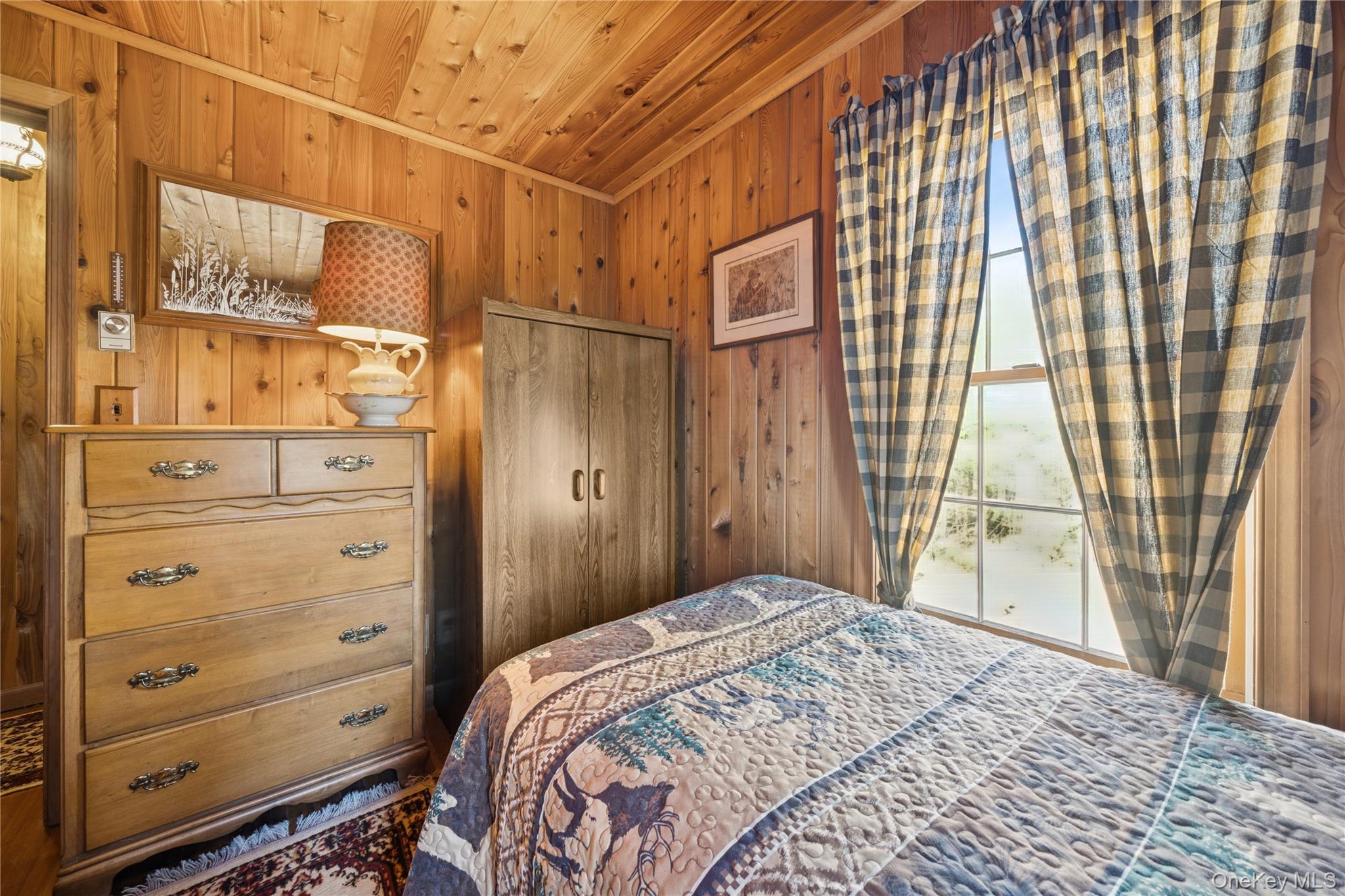 37 Nober Strunk Road Narrowsburg, NY 12764 - Photo 27 of 50 a bedroom with a bed and a window