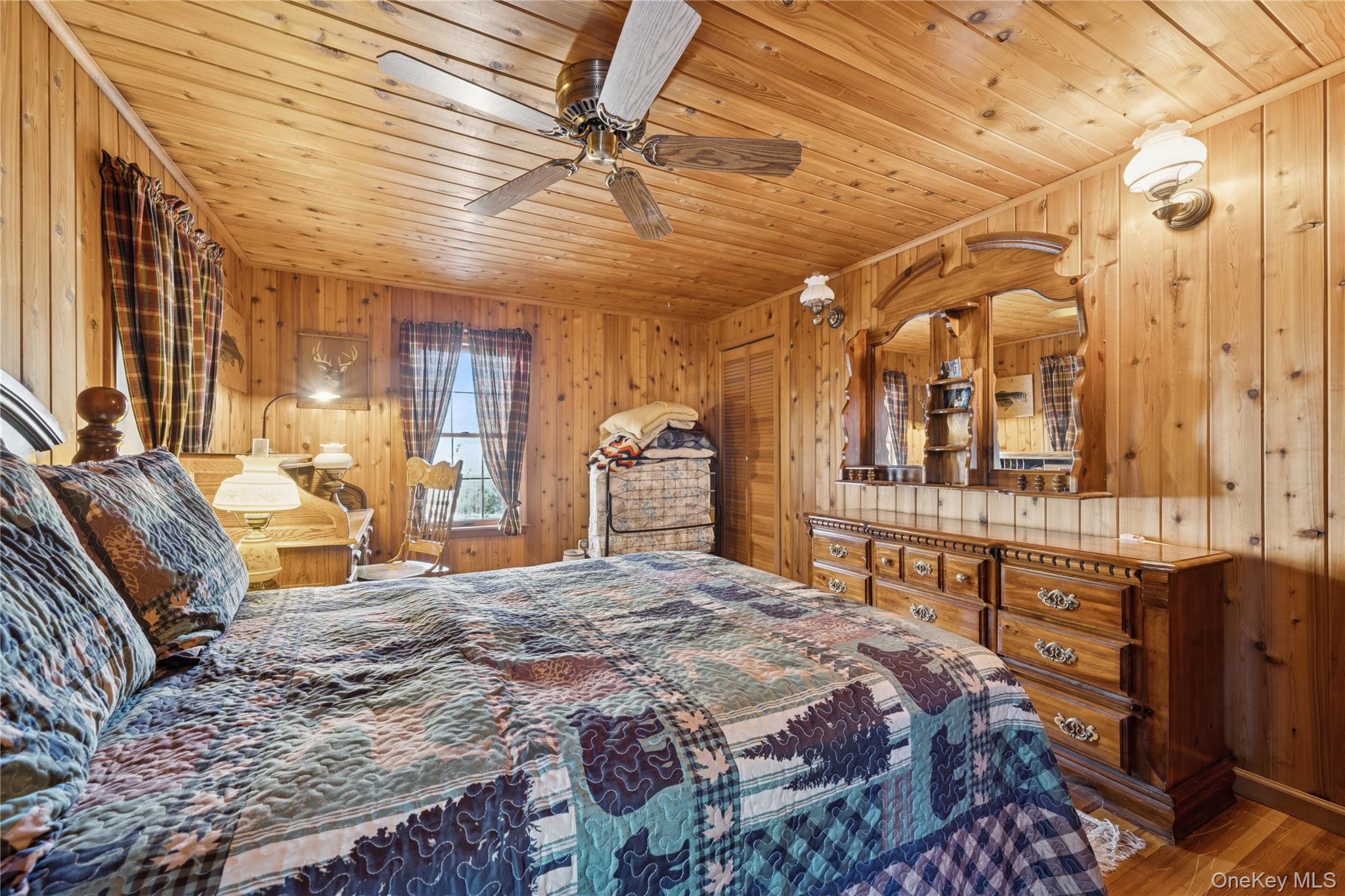 37 Nober Strunk Road Narrowsburg, NY 12764 - Photo 30 of 50 a spacious bedroom with a bed a dresser and windows