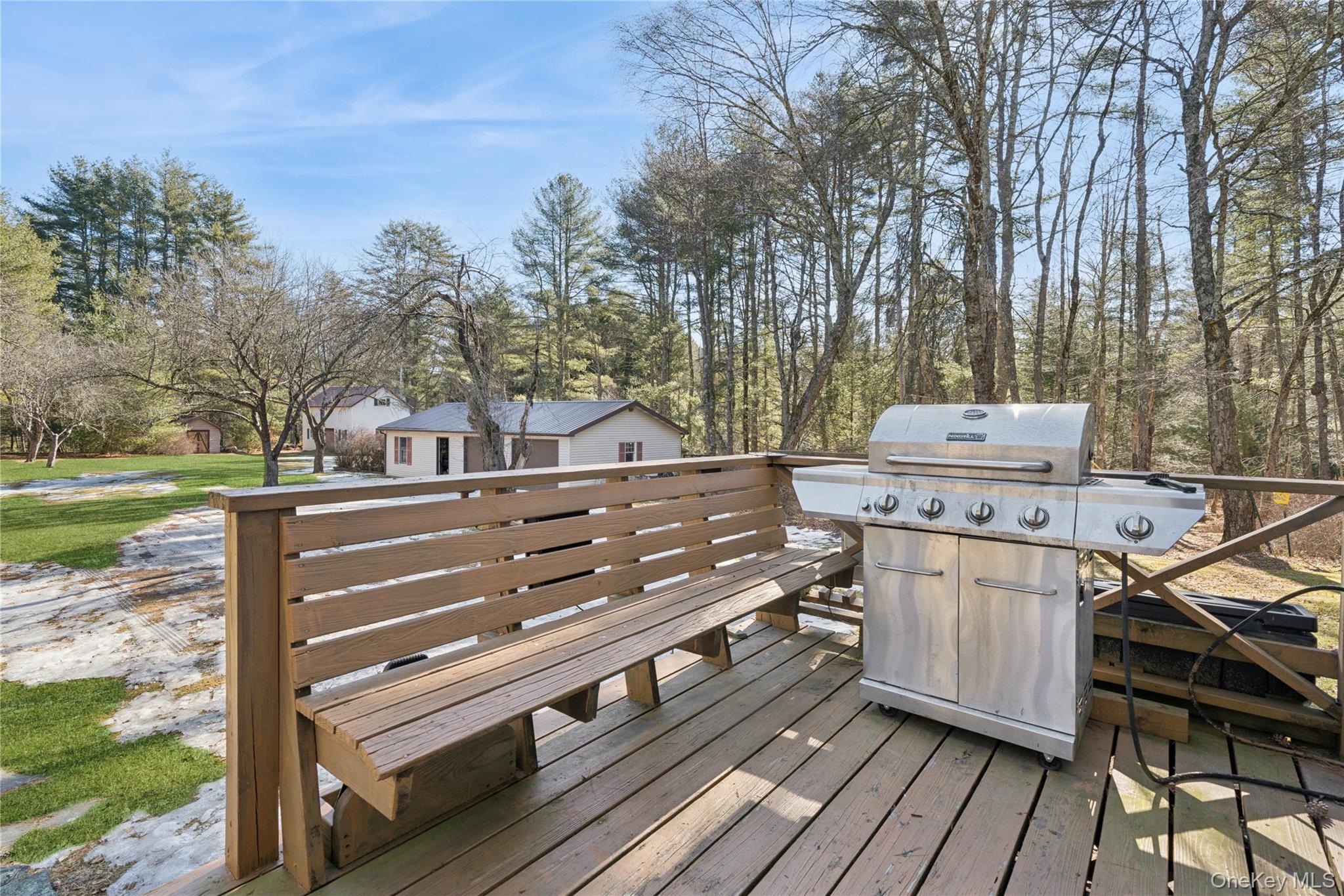 37 Nober Strunk Road Narrowsburg, NY 12764 - Photo 33 of 50 a view of a patio with table and chairs with wooden floor and fence